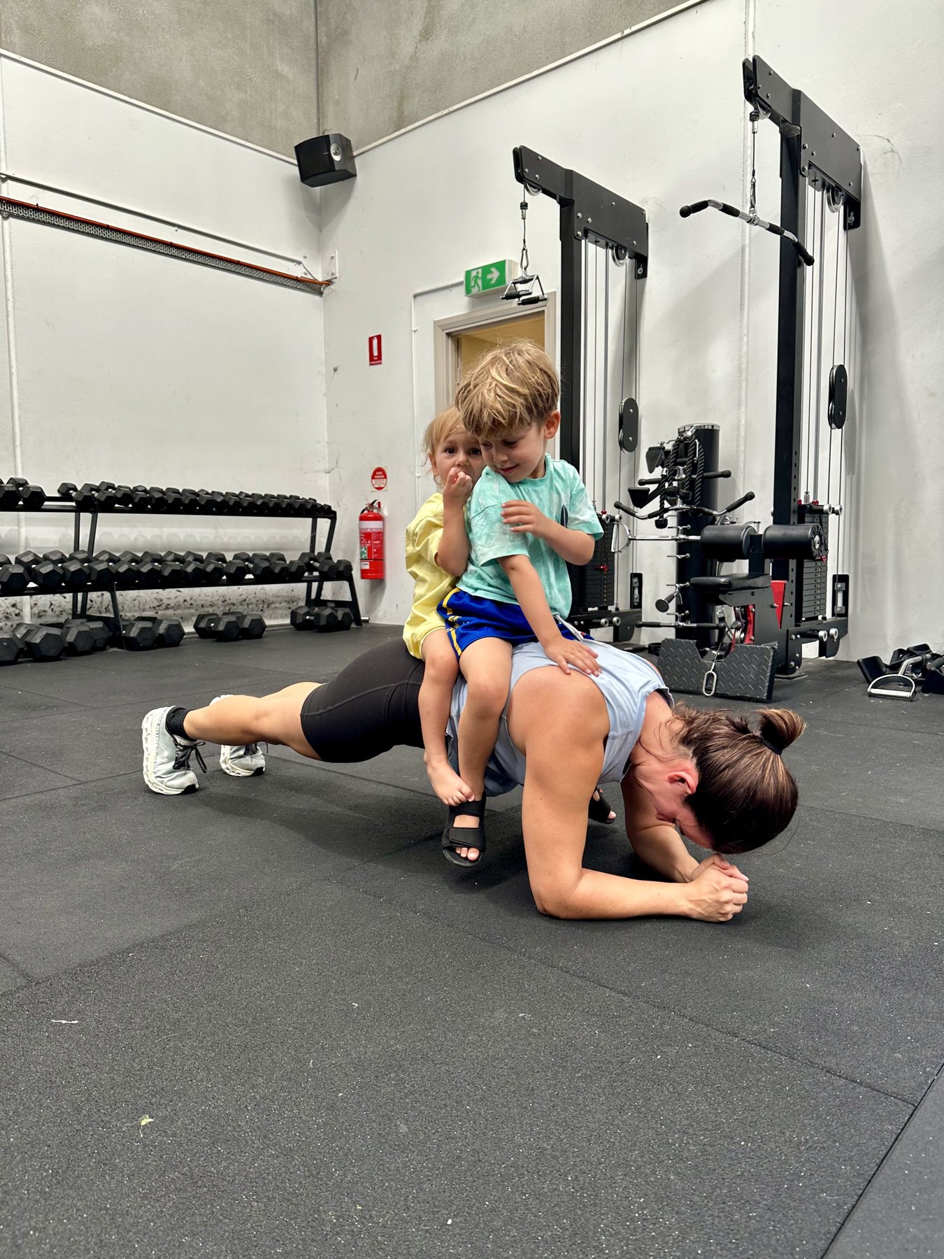 A parent training while her children join in at The Hive